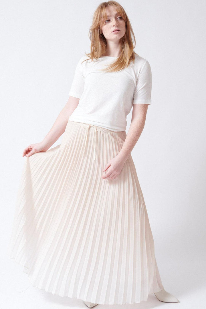 Waverly wearing SCAGLIONE Long Shade Plisse Skirt front view
