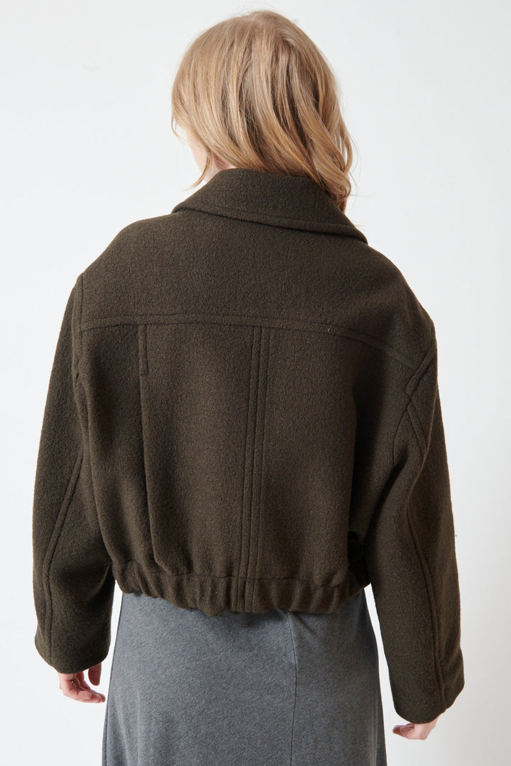 Madi wearing Apiece Apart Ria Cropped Back Jacket rear view