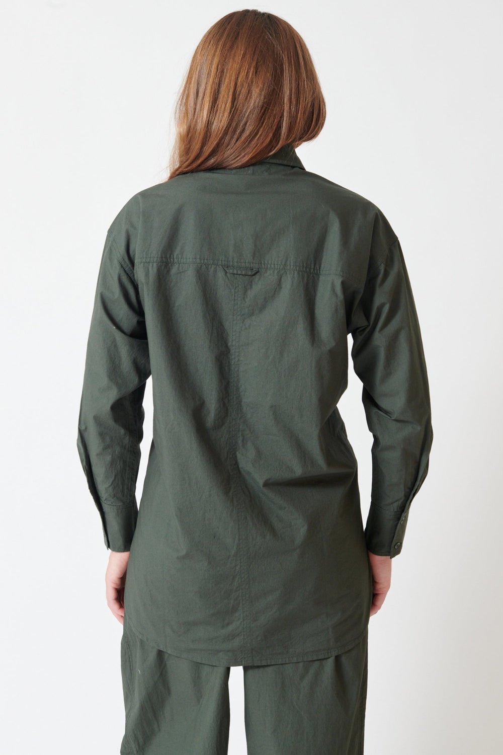 Julia wearing Apiece Apart Oversized Button Down rear view