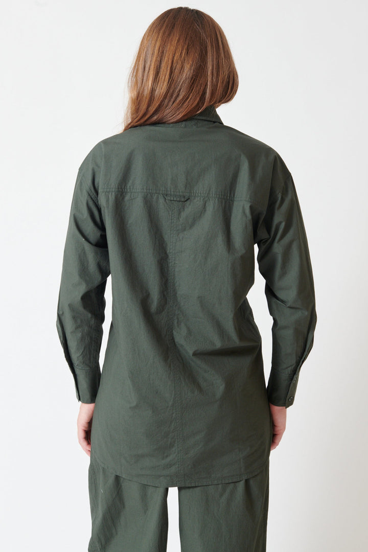 Julia wearing Apiece Apart Oversized Button Down rear view
