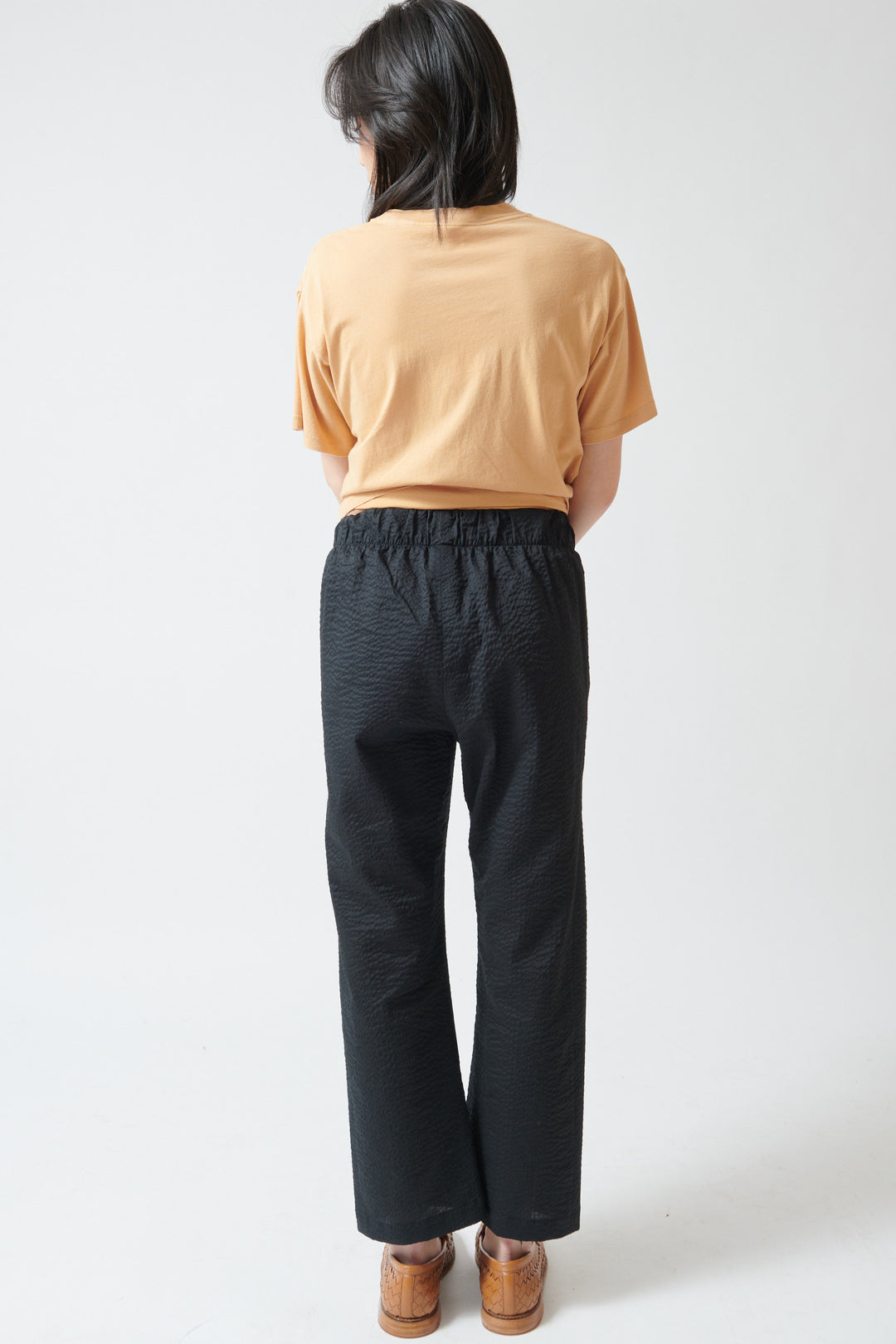 Lilly wearing Zero + Maria Cornejo Eko Ripple Twill Pant rear view