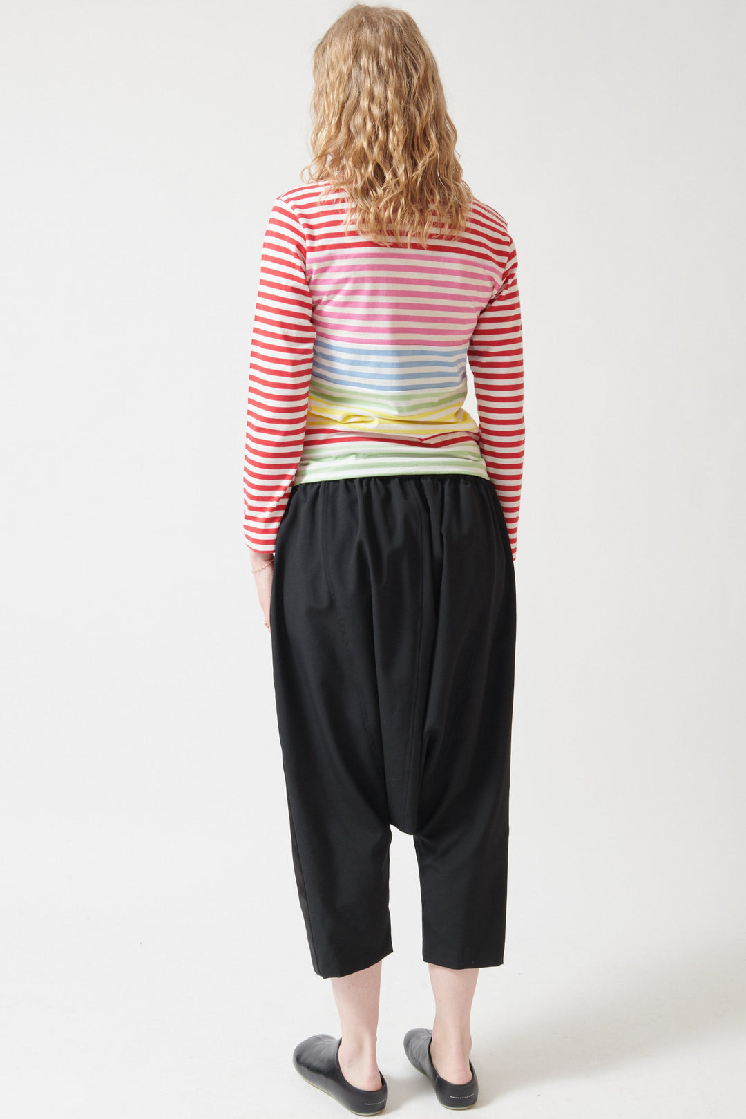 Madi wearing Comme des Garçons Drop Crotch Tuxedo Pant rear view