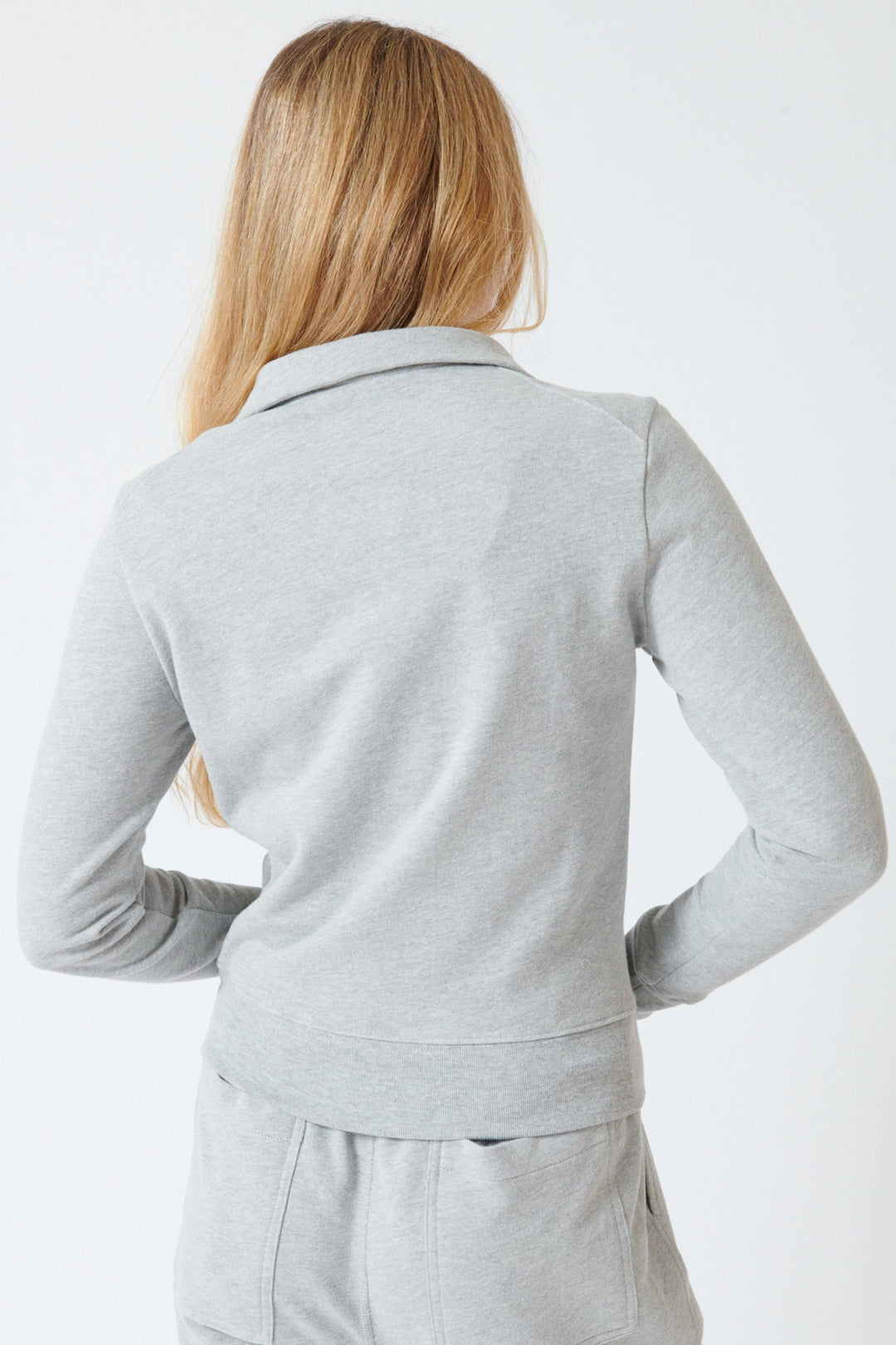 Mari wearing Nili Lotan Diya Quarter Zip Sweatshirt rear view