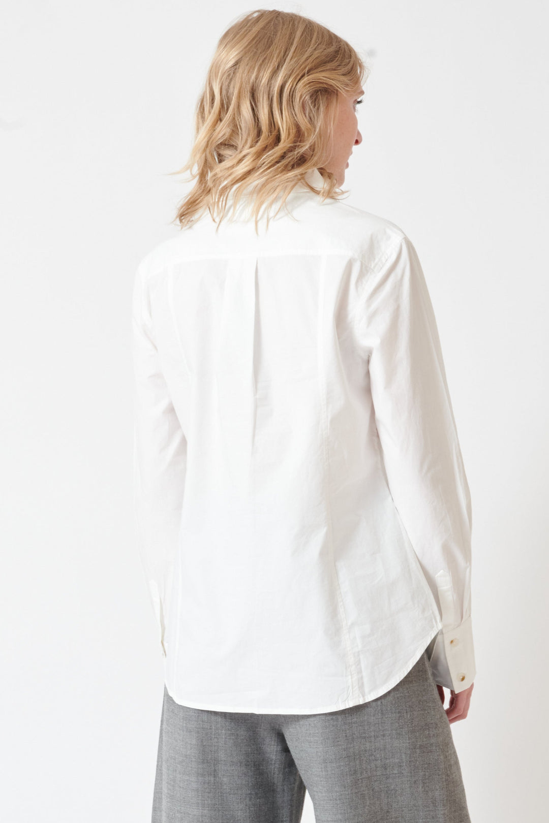 Madi wearing Apiece Apart Amine Fitted Shirt rear view