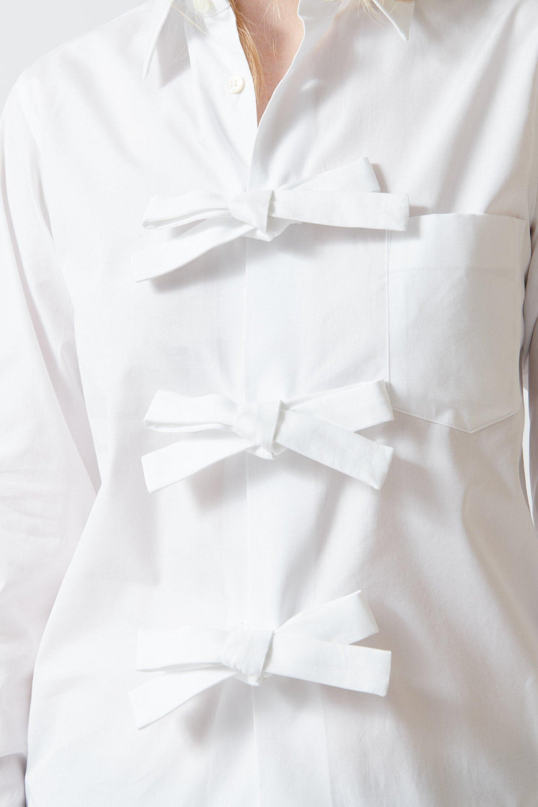 Madi wearing Comme des Garçons Three Bow Shirt front/detail view