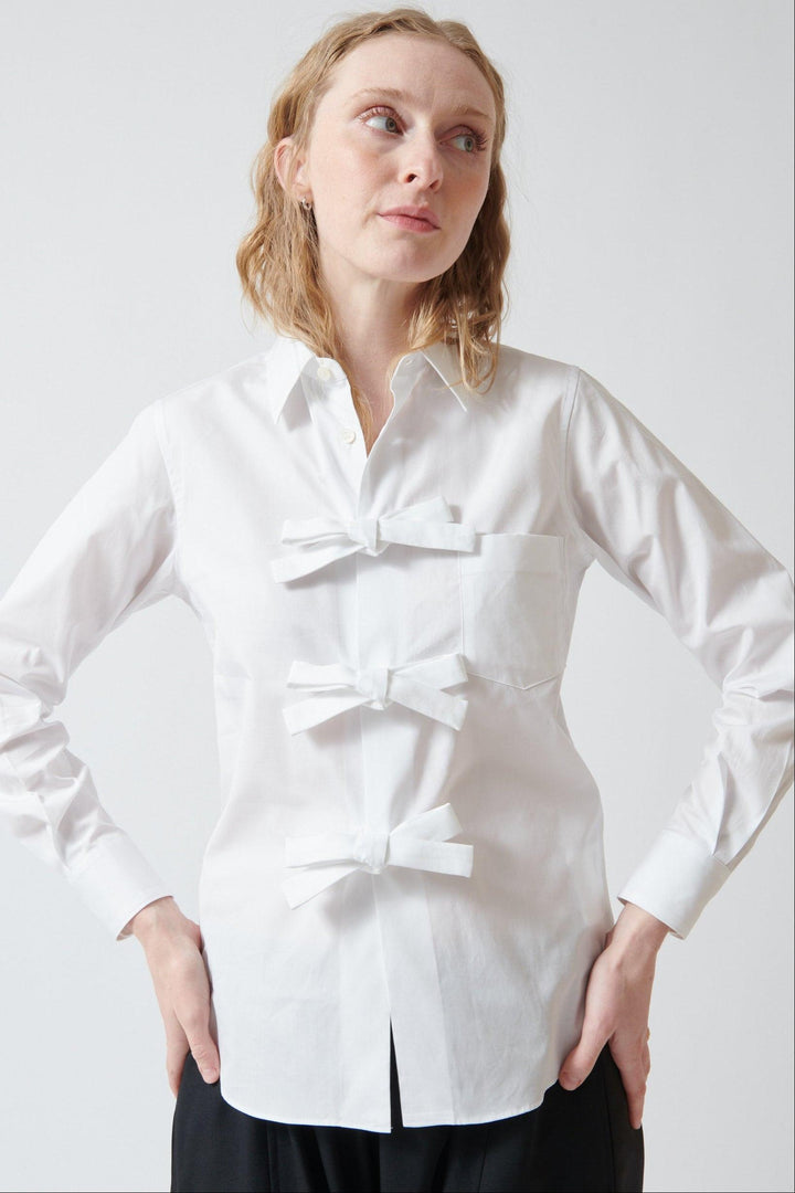 Madi wearing Comme des Garçons Three Bow Shirt front view