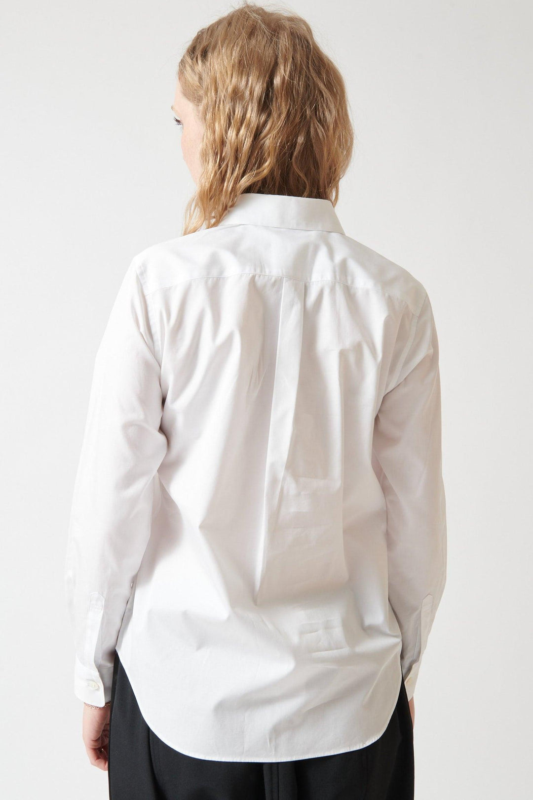 Madi wearing Comme des Garçons Three Bow Shirt rear view