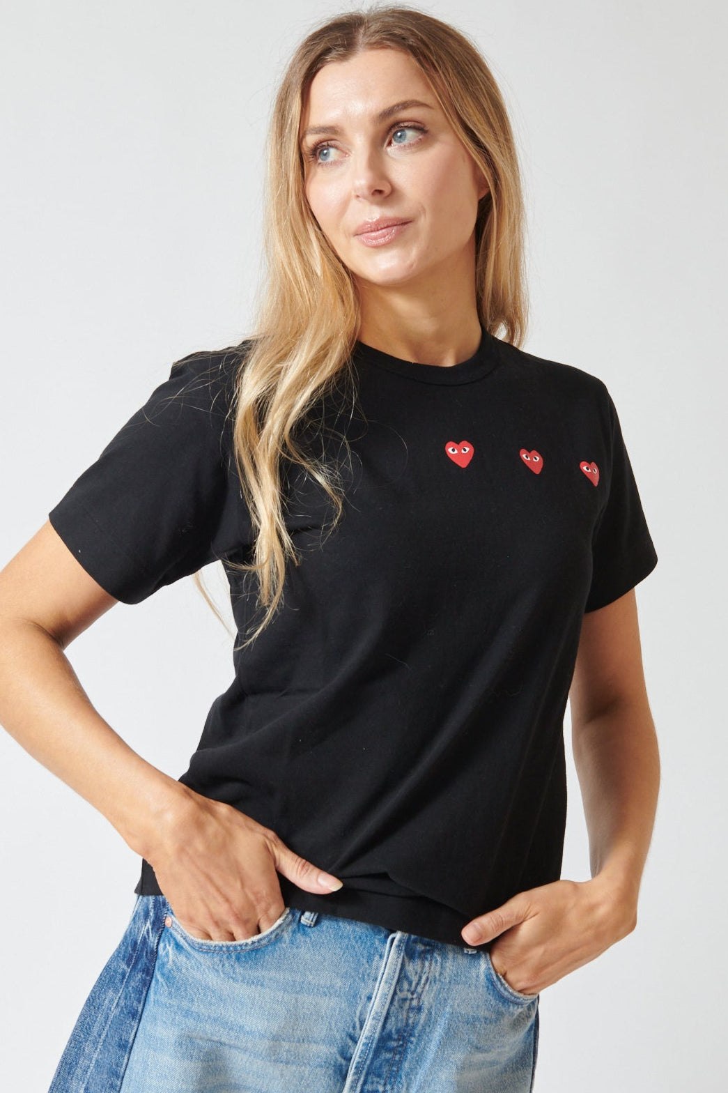 Mari wearing Comme des Garçons PLAY Trio Heart Logo Print T-Shirt front view 