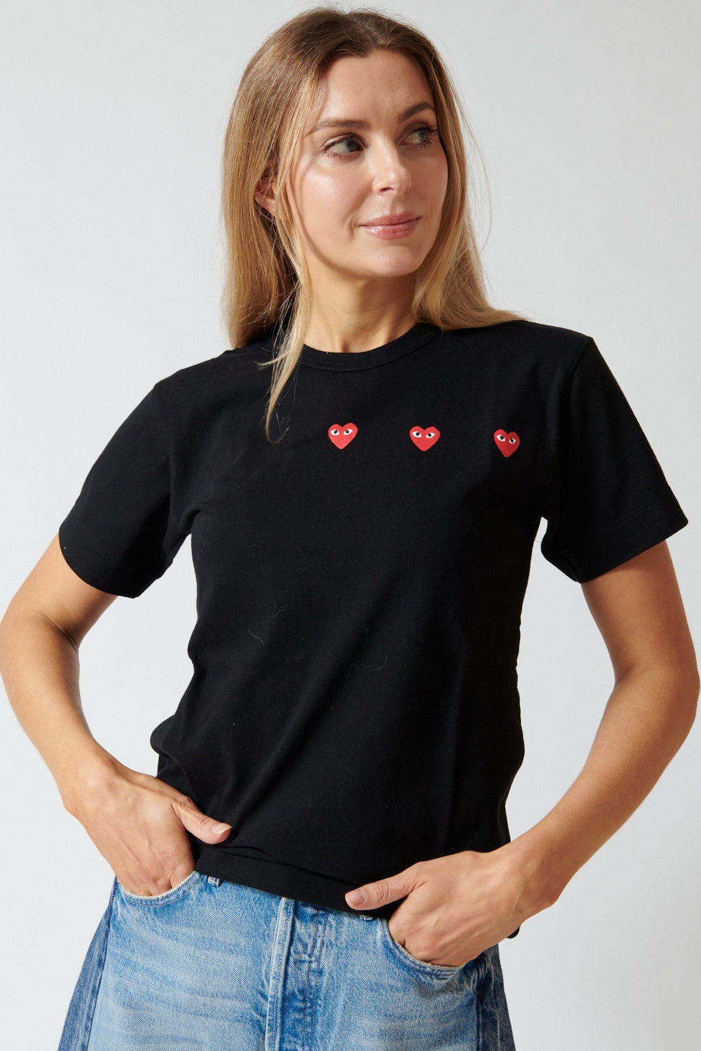 Mari wearing Comme des Garçons PLAY Trio Heart Logo Print T-Shirt front view 