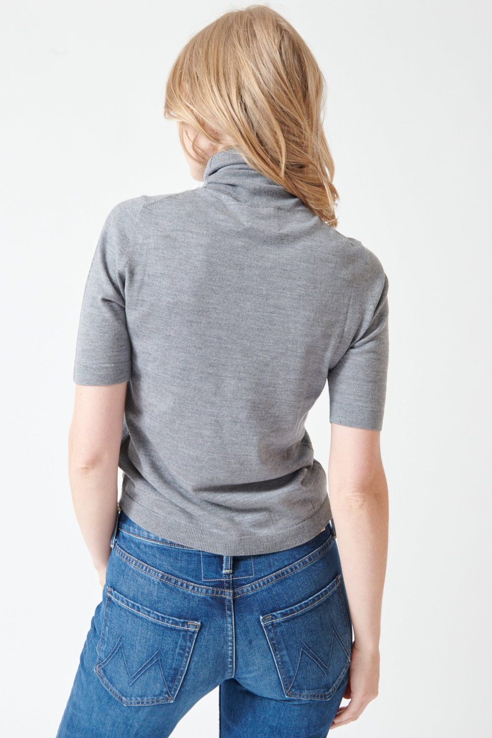Madi wearing Allude Half Sleeve Fine Rib Wool Turtleneck Sweater rear view