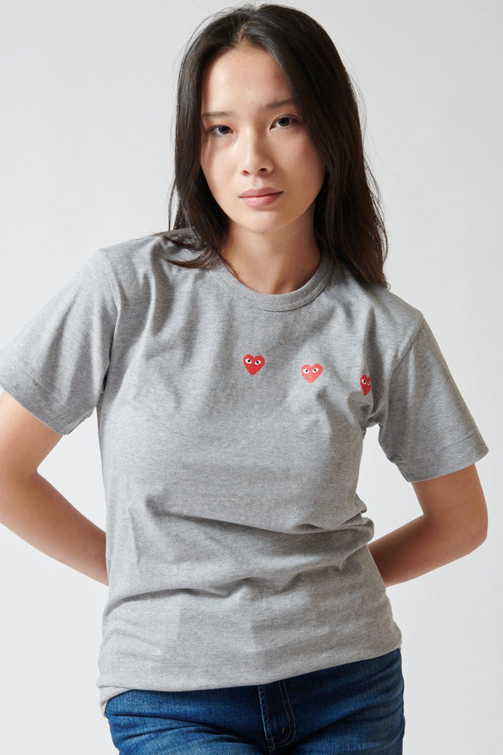 Lilly wearing Comme des Garçons PLAY Trio Heart Logo Print T-Shirt front view