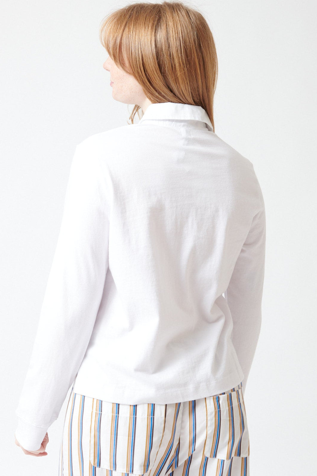 Waverly wearing LESET Margo Long Sleeve Polo rear view