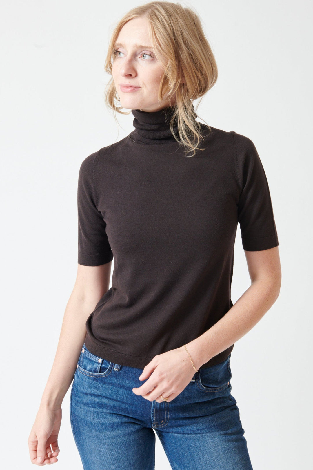Madi wearing Allude Half Sleeve Fine Rib Wool Turtleneck Sweater front view