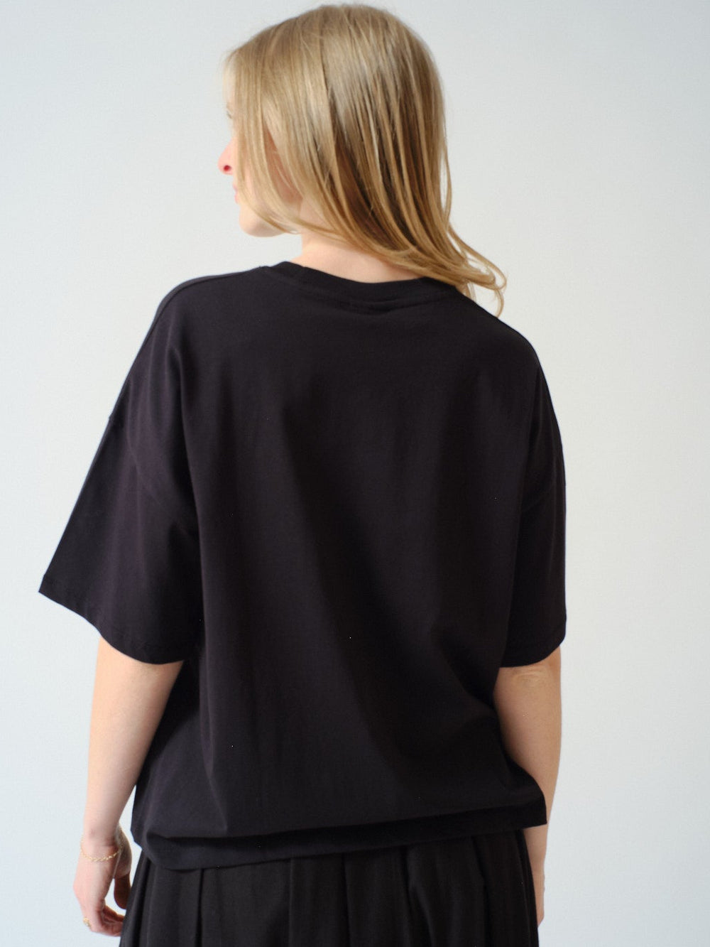 Madi wearing Kowtow Motif Tee rear view