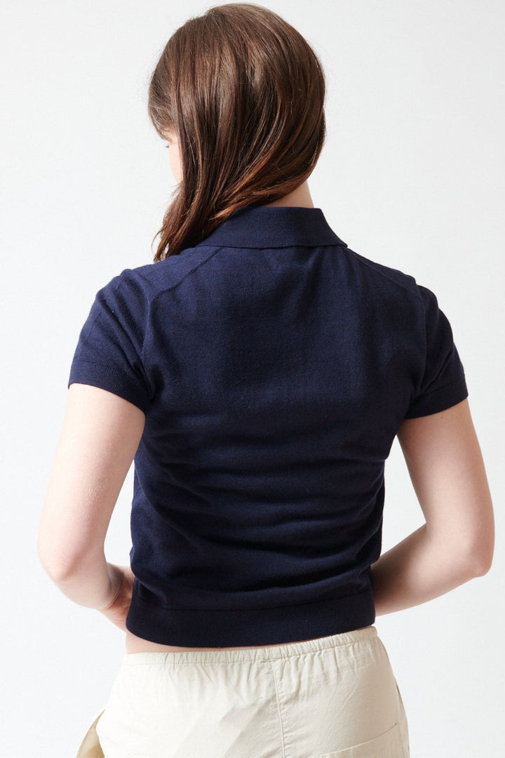 Sophie wearing LESET James Short Sleeve Polo rear view