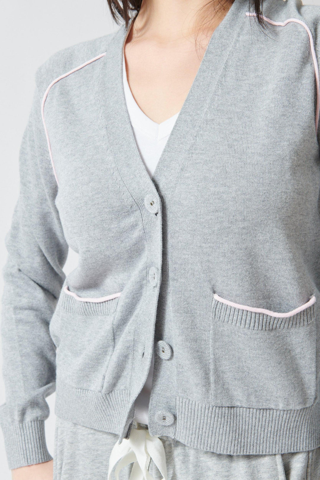 Lilly wearing Lilla P Saddle Sleeve V Neck Cardigan front view