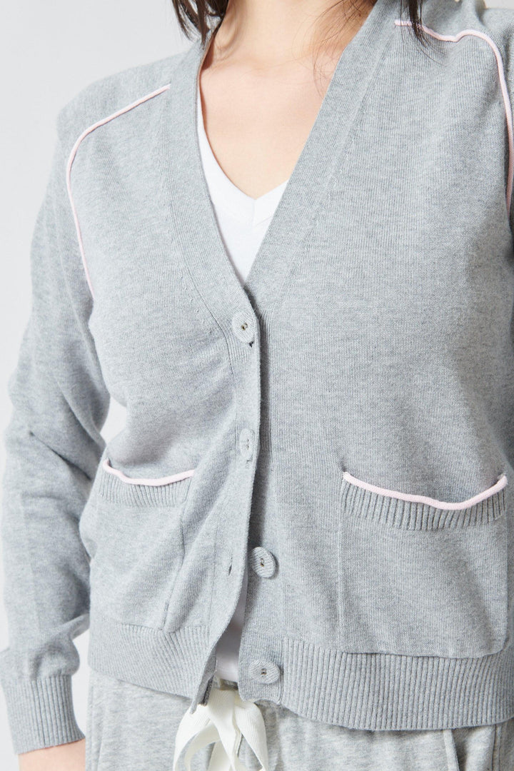 Lilly wearing Lilla P Saddle Sleeve V Neck Cardigan front view