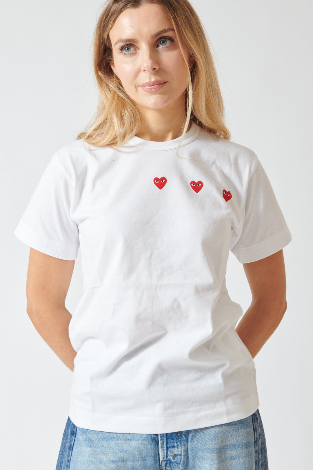 Mari wearing Comme des Garçons PLAY Trio Heart Logo Print T-Shirt front view