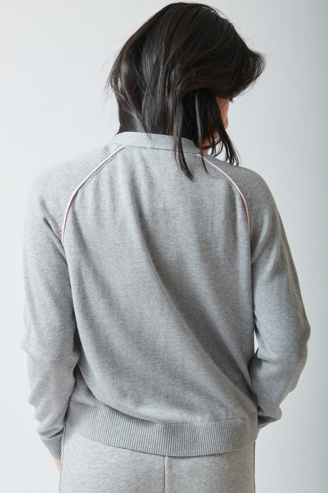 Lilly wearing Lilla P Saddle Sleeve V Neck Cardigan rear view