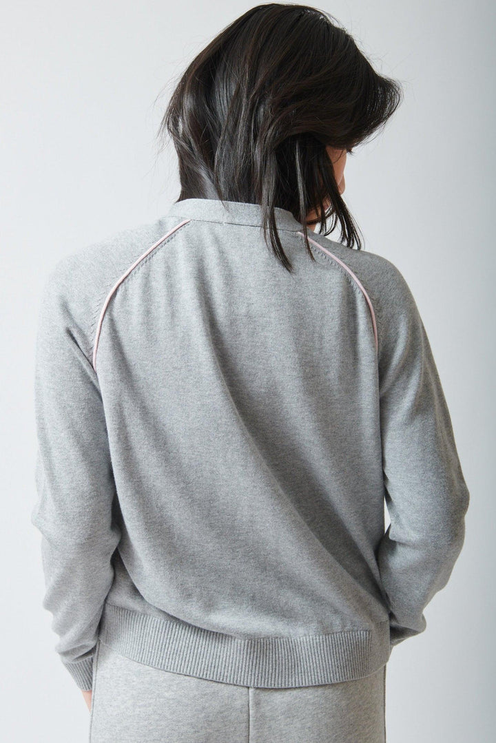 Lilly wearing Lilla P Saddle Sleeve V Neck Cardigan rear view