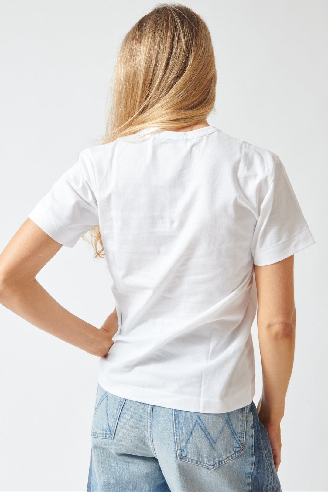 Mari wearing Comme des Garçons PLAY Trio Heart Logo Print T-Shirt rear view