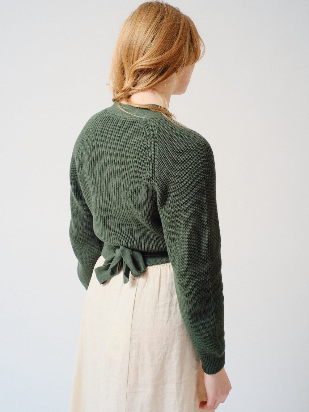 Waverly wearing Kowtow Composure Cardigan rear view
