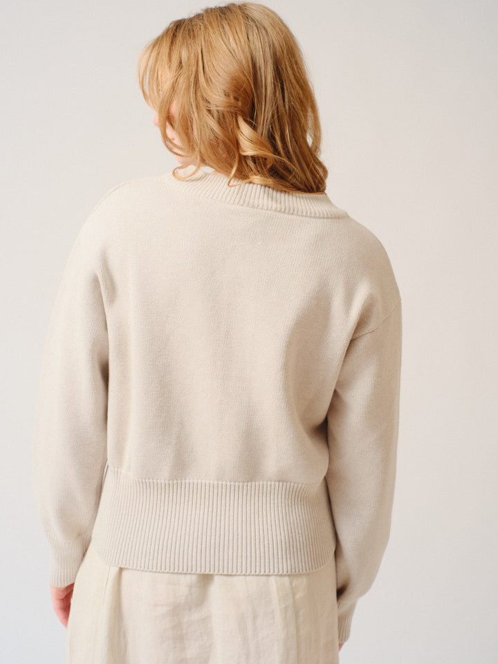Waverly wearing Kowtow Silhouette Cardigan rear view