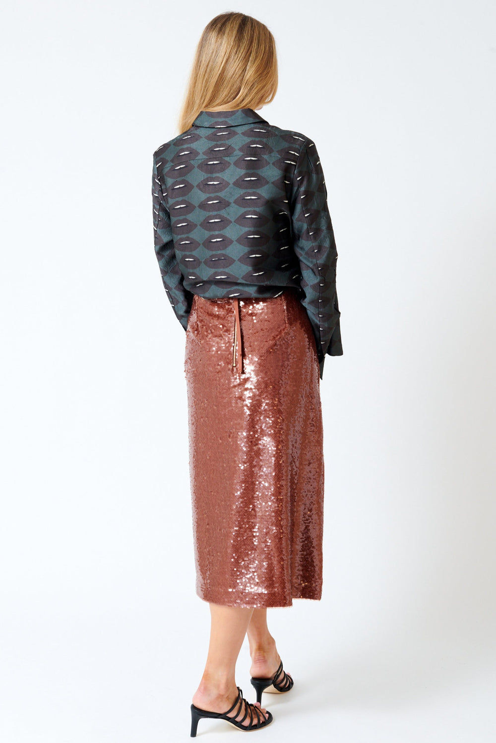 Mari wearing Odeeh Sequin Zip Back Skirt rear view