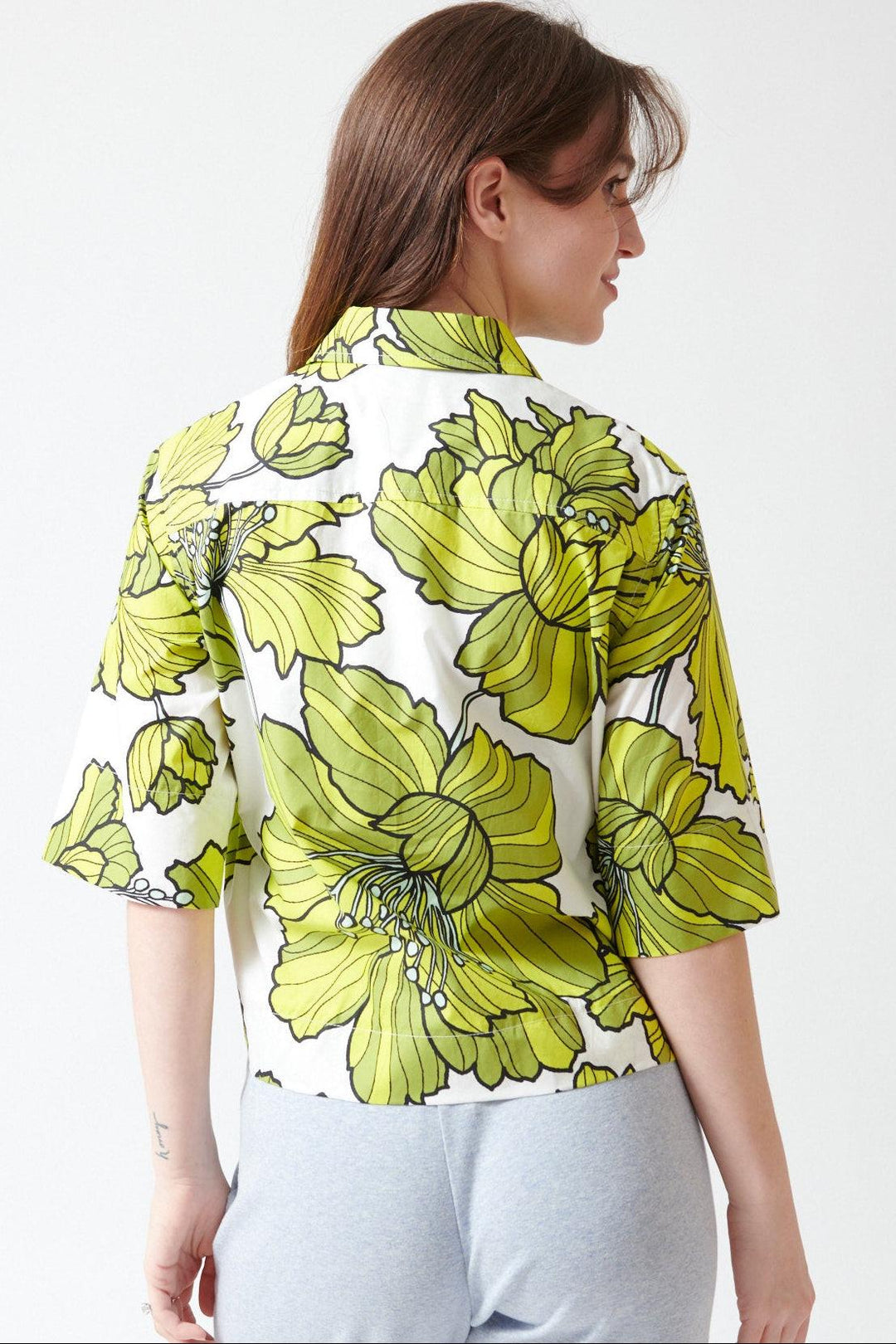 Sophie wearing Odeeh Cotton Hibiscus Shirt rear view