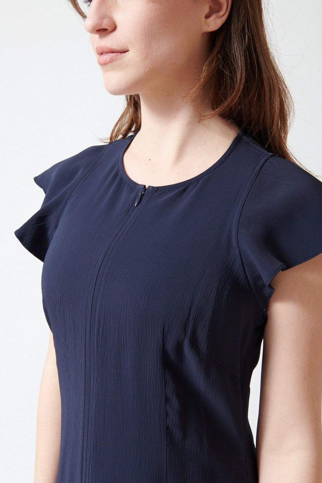 Sophie wearing Apiece Apart Gisa Zip Dress front/detail view
