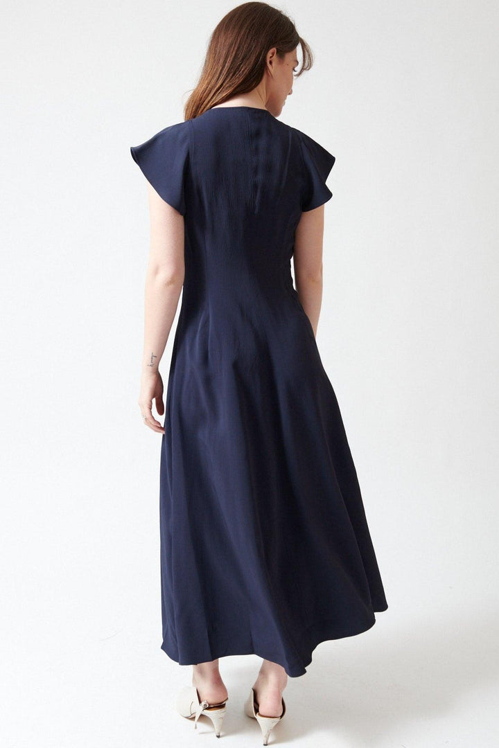 Sophie wearing Apiece Apart Gisa Zip Dress rear view