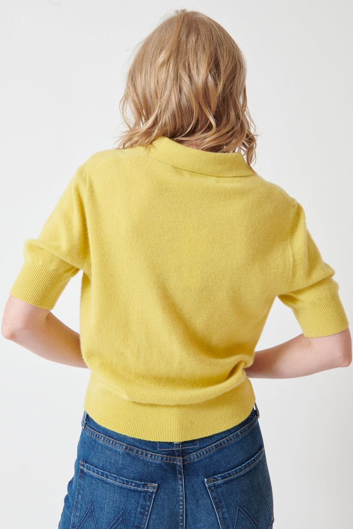 Madi wearing White + Warren Cashmere Polo Top rear view