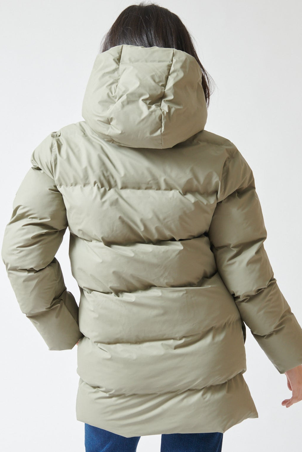 Lilly wearing Rains Alta Long Puffer Cargo Jacket rear view