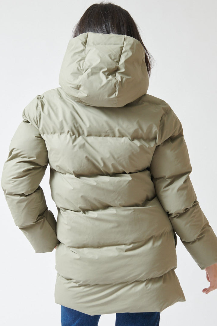 Lilly wearing Rains Alta Long Puffer Cargo Jacket rear view