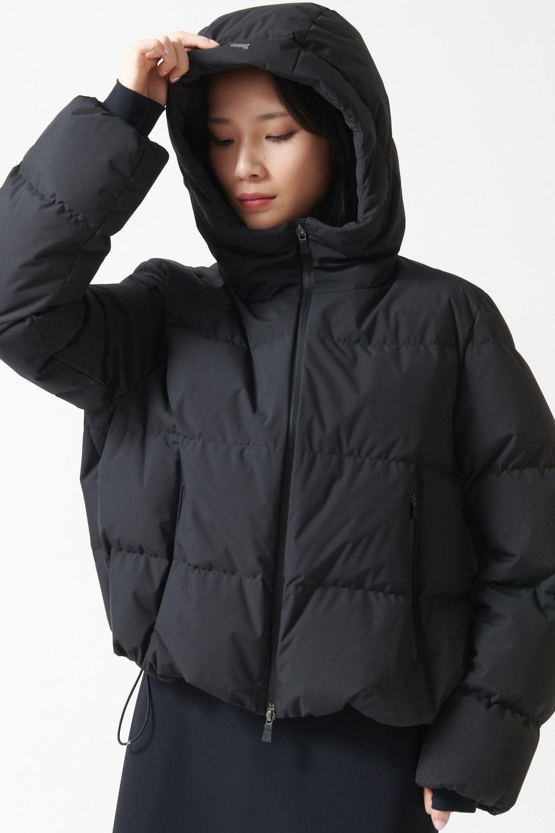 Lilly wearing Herno Short Hooded Puffer Coat front view