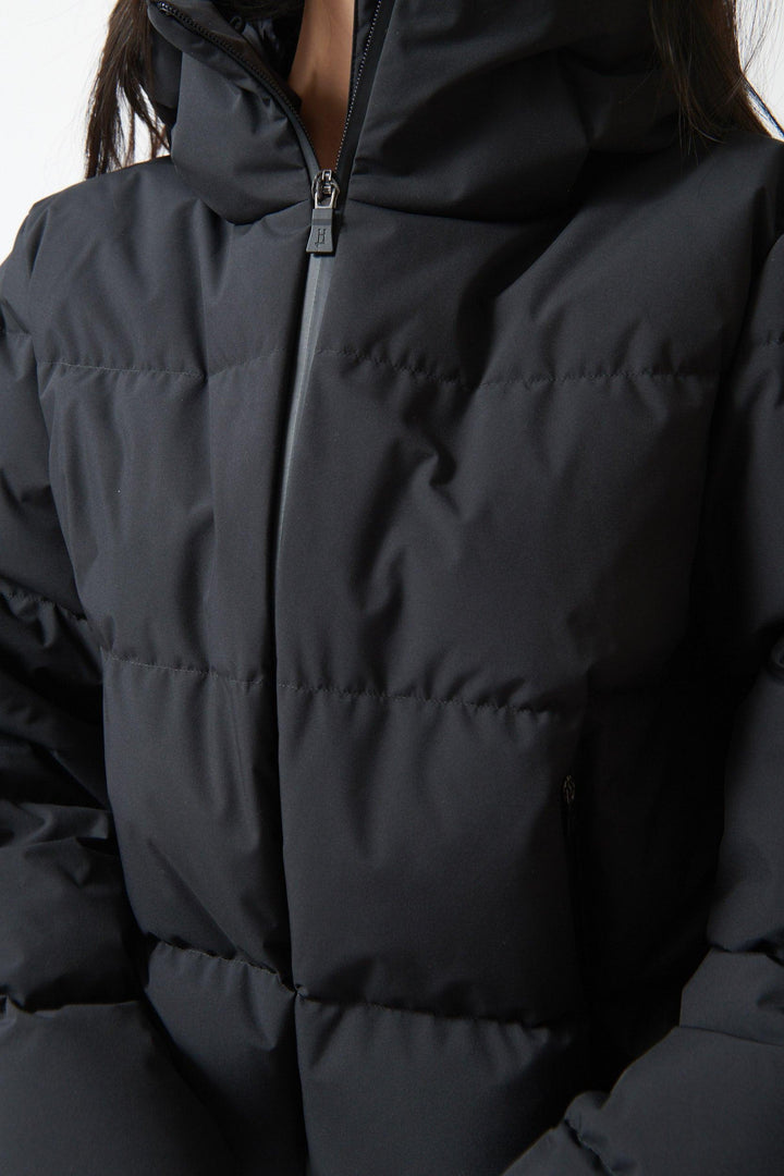 Lilly wearing Herno Short Hooded Puffer Coat front view
