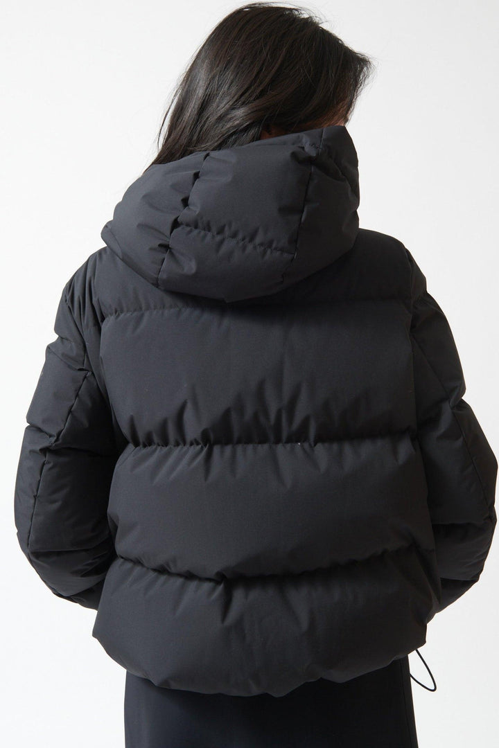 Lilly wearing Herno Short Hooded Puffer Coat rear view