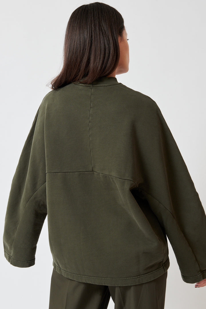 Model wearing Christian Wijnants Tahoras Sweater rear view