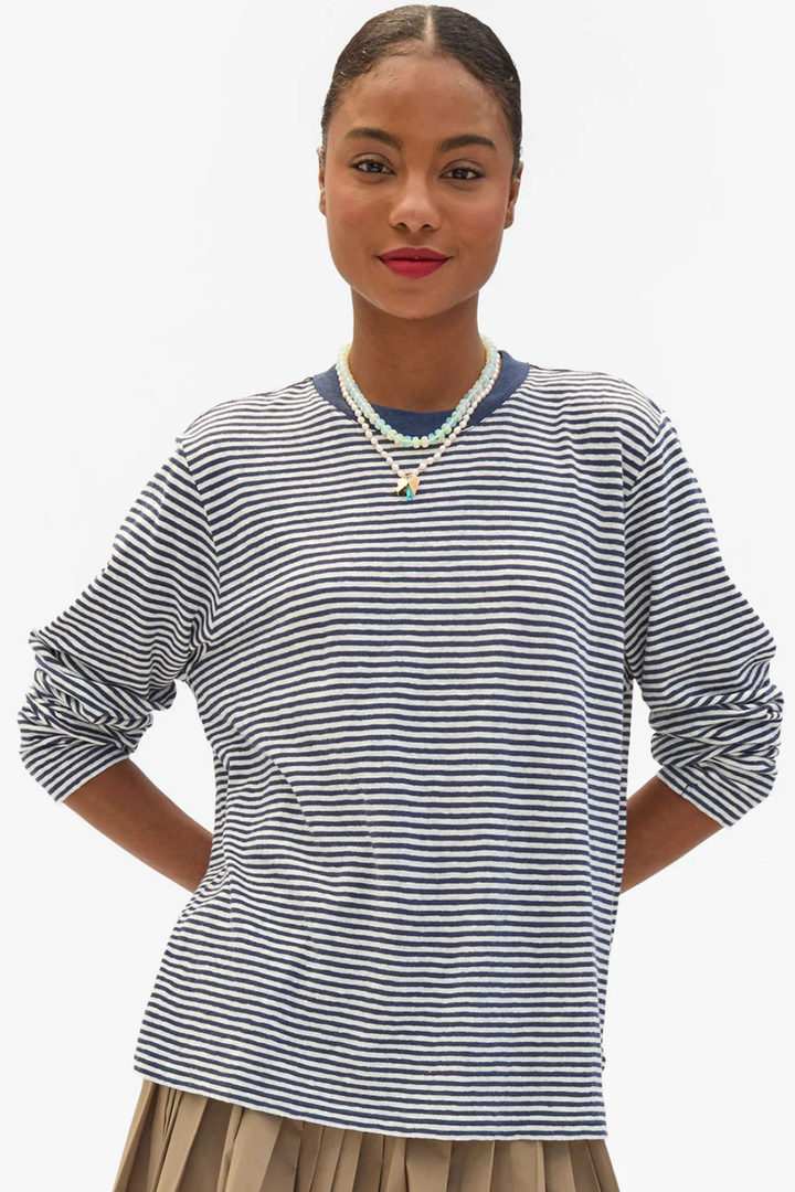 Model wearing Clare V. Cotton Linen Long Sleeve Tee Navy Cream Mini Stripe front view