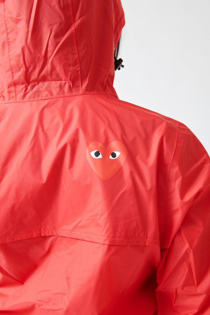Lilly wearing Comme des Garçons PLAY K-Way Full Zip Red Emblem Unisex Jacket Red rear view