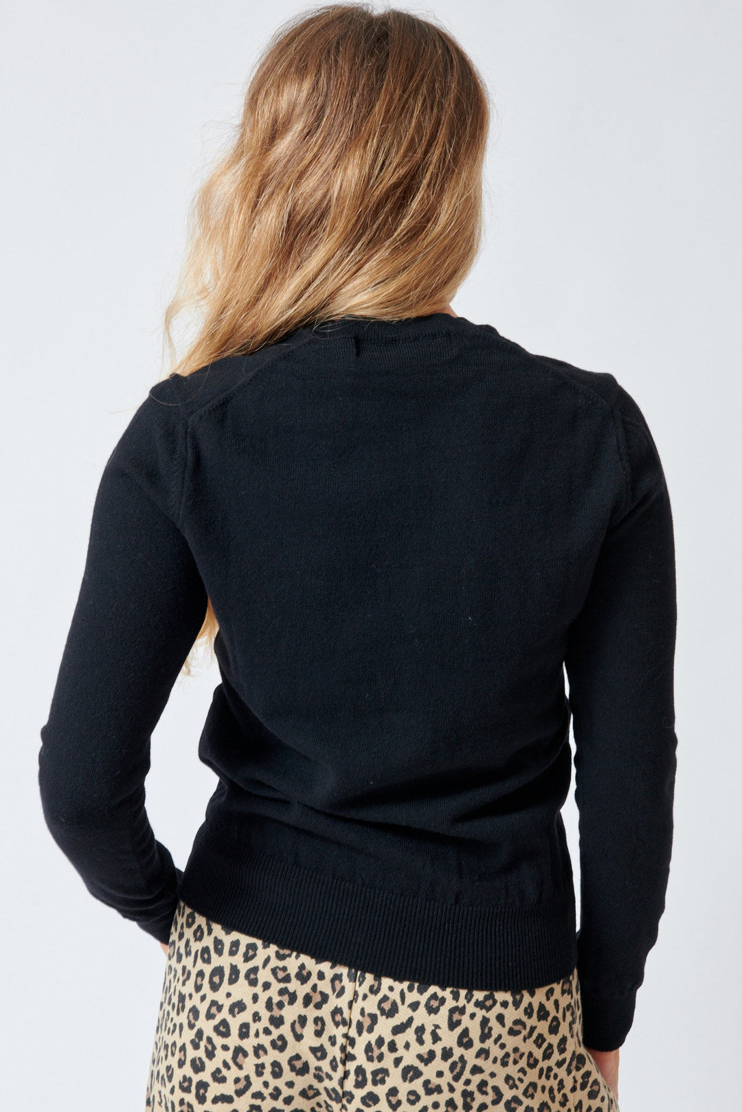 Mari wearing Comme des Garçons PLAY Pink Emblem Round Neck Cardigan Black rear view
