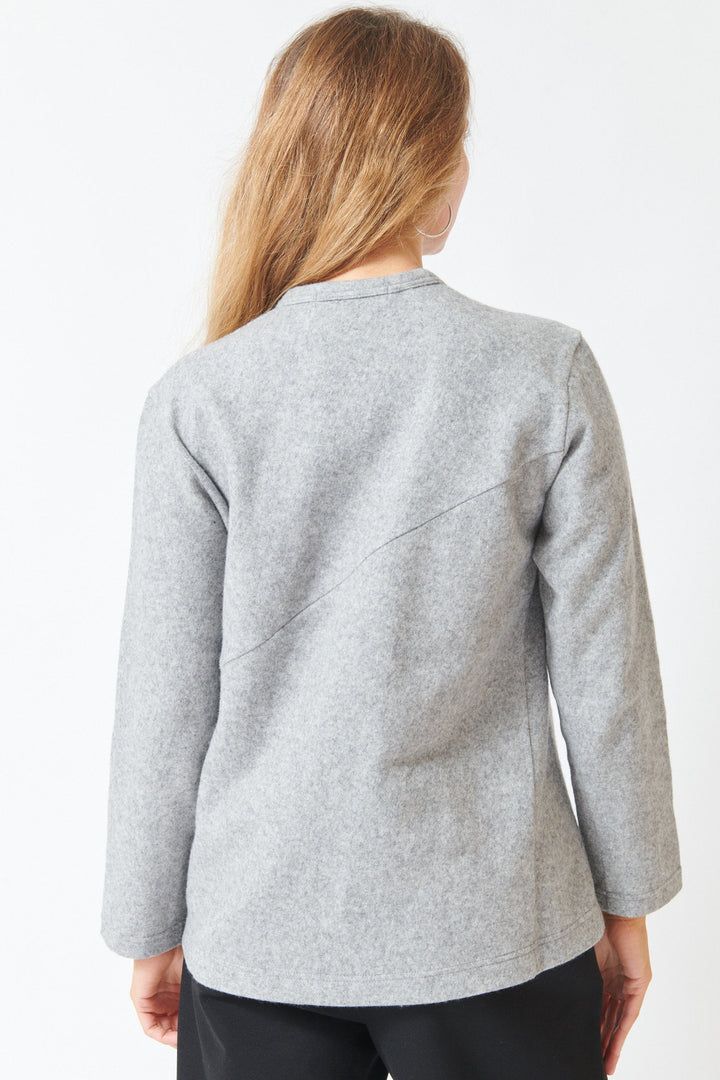 Mari wearing Comme des Garçons Wool Blend Diagonal Seam Long Sleeve Tee Light Grey rear view