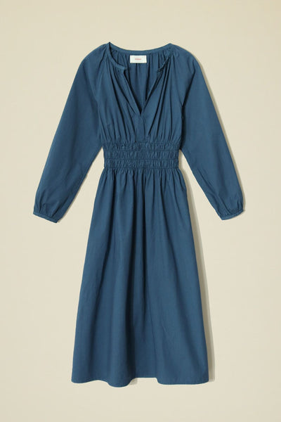 Full front view of long-sleeved blue cotton dress, not on model.