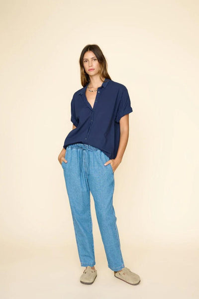Front view of model wearing nightingale/light blue denim pants