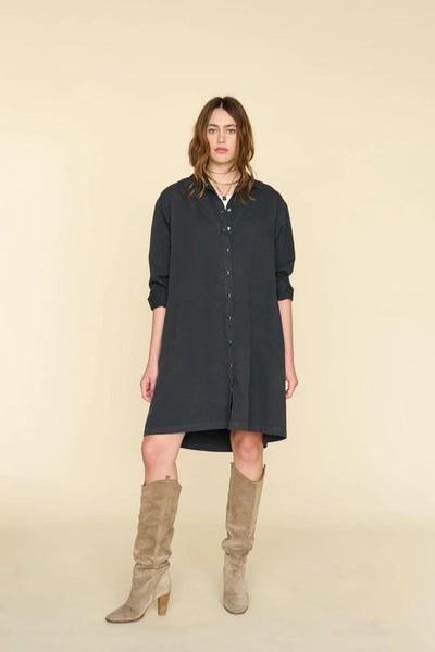 Front view of model wearing black midi-length button down shirt dress