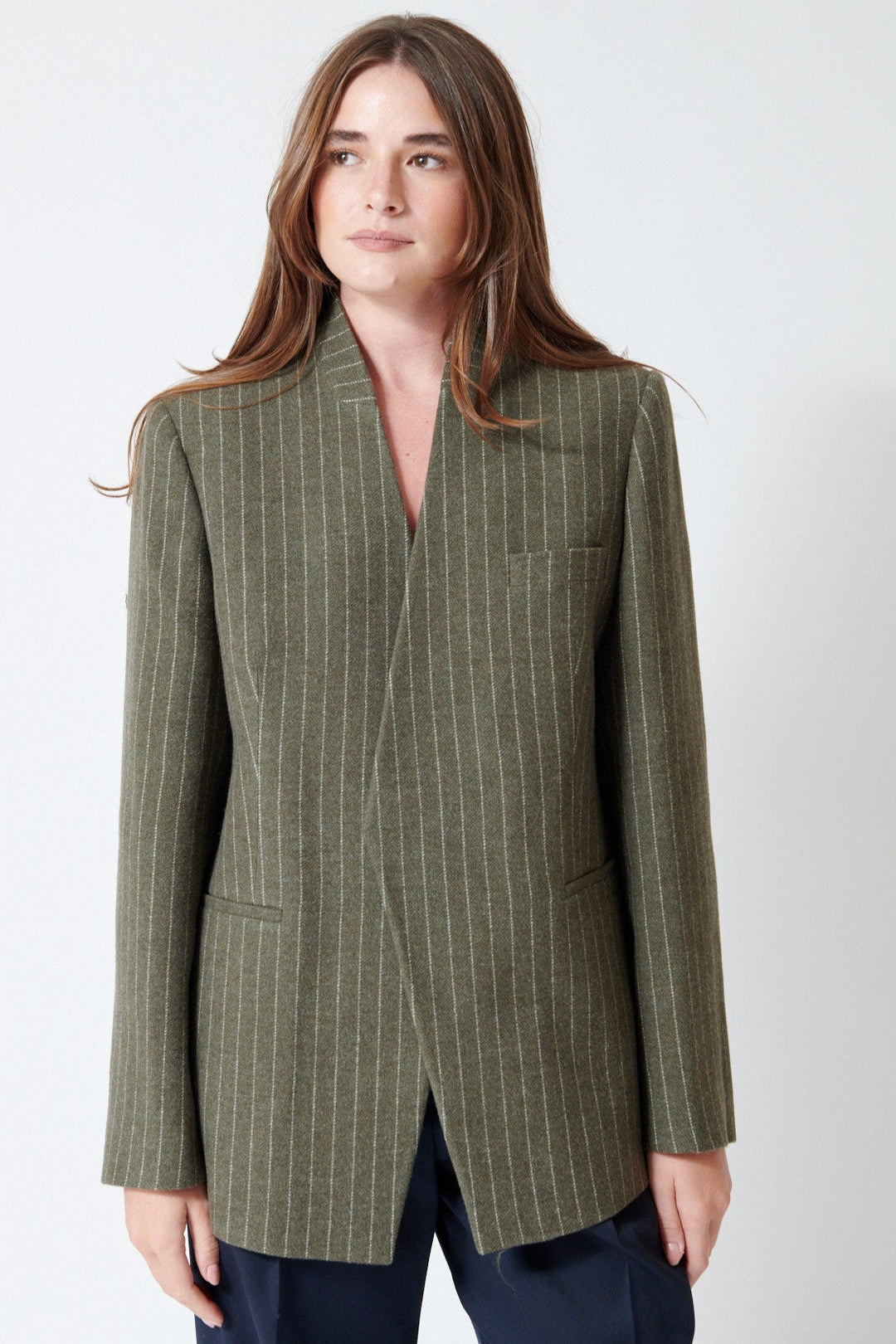 Julia wearing Christian Wijnants Jorolo Jacket in Khaki Stripe, front view.