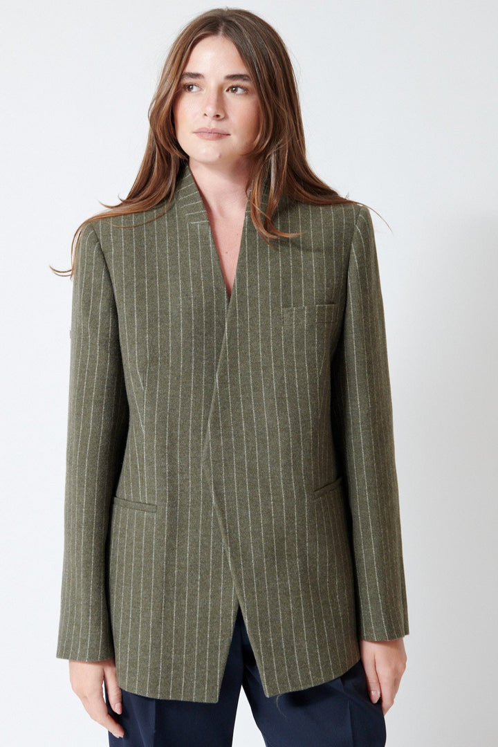 Julia wearing Christian Wijnants Jorolo Jacket in Khaki Stripe, front view.