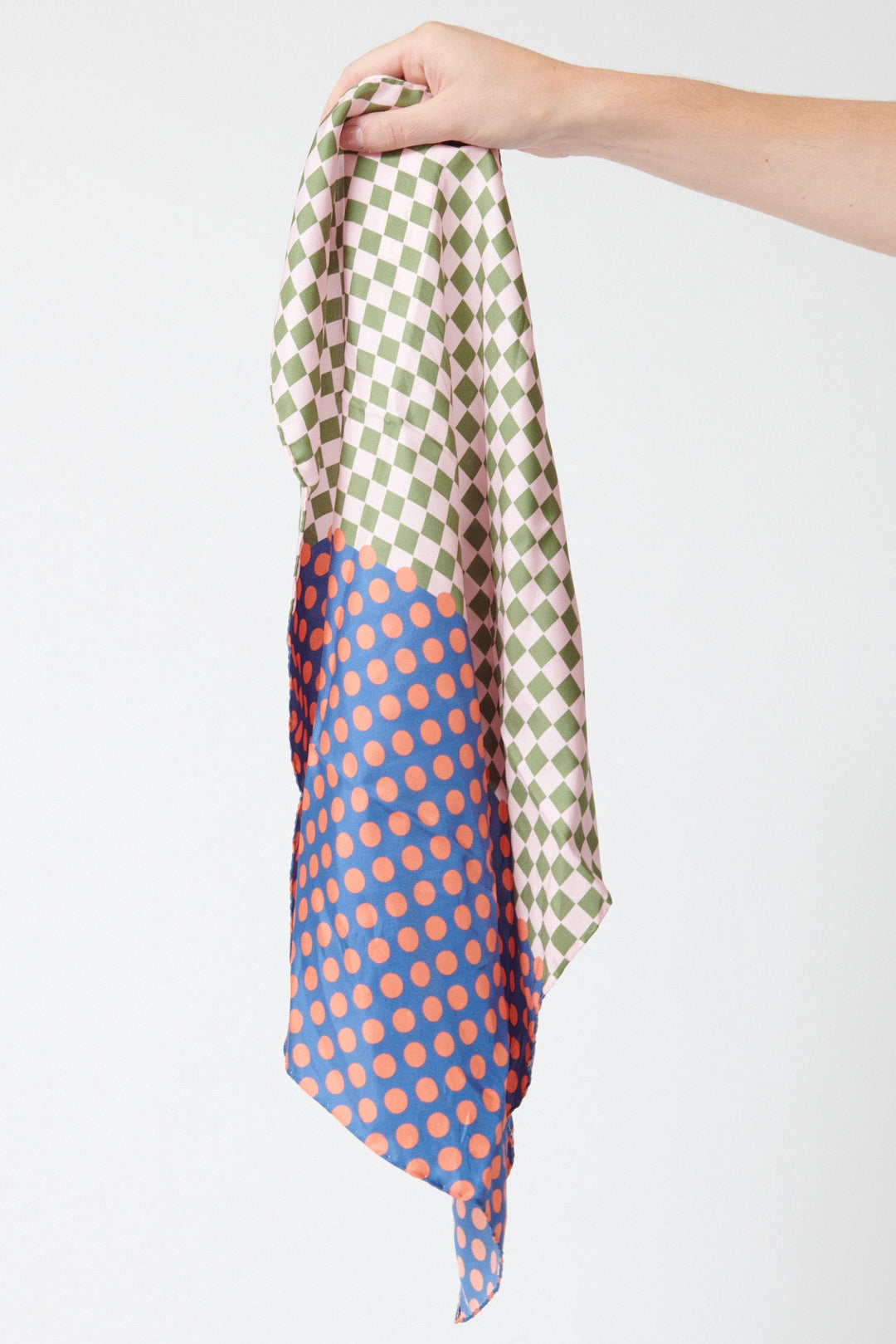 Model holding Épice Carre Bandana 52x52 cm Navy front view