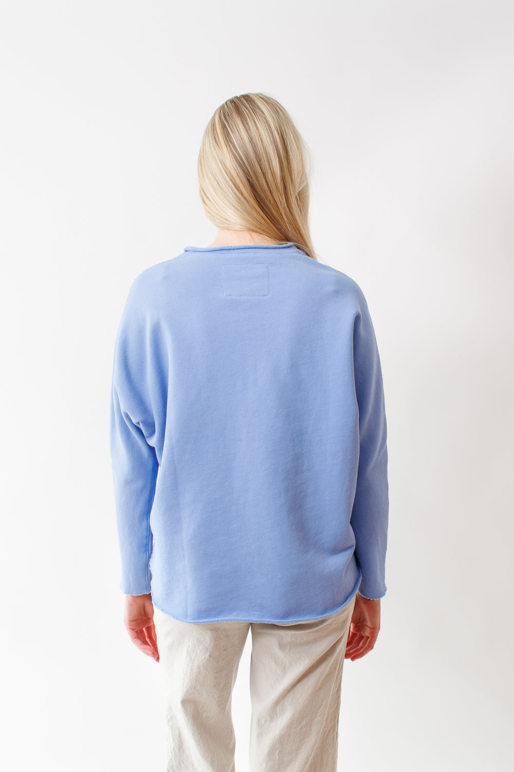 Bailey wearing Frank & Eileen Anna Long Sleeve Capelet rear view