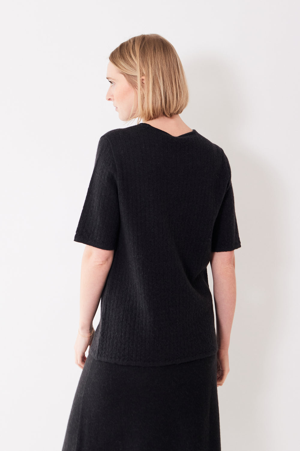Madi wearing Lauren Manoogian Line Quilt Tee rear view